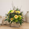 Yellow daisy bouquet in a rustic wooden box