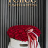 Round box of red roses with a ribbon bow