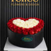 Heart-shaped box of red and white roses