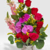 Hot pink and red roses, pink snaps and orchids arrange in a