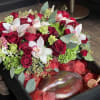 Black box of mix roses and orchids and breakable chocolate heart or