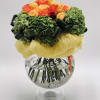 Bouquet of orange and yellow roses in a clear glass vase