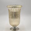 Gold and clear striped decorative vase with a silver base