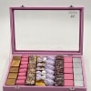 Pink gift box with assorted wrapped chocolates and candies