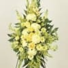 Tall yellow floral standing spray on an easel