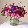 Bursting with vibrant hues, this bouquet is a vivid tapestry of fuchsia