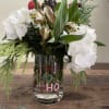White and green hydrangea, alstromeria, berries and cones