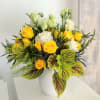 A combination of bright yellow and white seasonal flowers will be combined