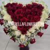 INCLUDES WHITE ROSES AND RED ROSES . BABY BREATH WITH GREENERY 