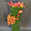 This elegant arrangement with calla lilies and cymbidium orchids its phenomenal for