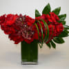 Vase made with red reflexed roses and Red Cymbidium.
