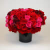 Red roses, hot pink roses and a touch of spray burgundy roses.