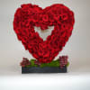 A well made heart with red roses.