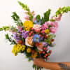Bright, seasonal blooms picked by the designer. This wrap is colorful with
