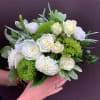 Let our designers select a variety of green and white blooms for