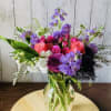 Purple stocks with seasonal flowers.