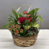 Basket arrangement with red roses and pink kalanchoe flowers