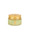 Small gold-lidded jar of lip balm with a green label