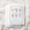 Decorative card with small illustrated flower bouquets and the words "you deserve all the flowers!"