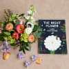 Mixed bouquet with peach, pink, white, and lavender flowers beside a book