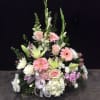 Tall pastel floral arrangement with roses, lilies, and gerbera daisies