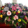 Large mixed floral spray with lilies, daisies, and roses
