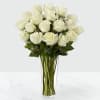 Bouquet of white roses in a clear glass vase