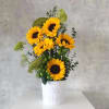 Sunflower arrangement in a white textured vase