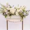 Long pastel floral arrangement in a white rectangular box