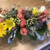 Mixed bouquet with pink roses, yellow lilies, and white calla lilies