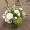 Greens and whites gives this arrangement a crisp, clean look appropriate for