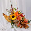 This fall arrangement makes for a beautiful centerpiece for any thanksgiving dinner.