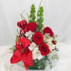This Valentine's Day arrangement is composed of red roses, bells of Ireland