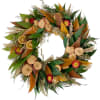 Autumn wreath with dried flowers, leaves, and orange slices