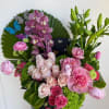 A joyful symphony of seasonal blooms bursting with color and life, this
