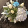 Bouquet with white roses, blue carnations, and pale hydrangea
