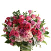 Pink and lavender rose bouquet in a glass vase