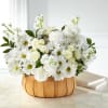 White daisies and roses arranged in a wooden basket
