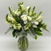 White floral bouquet in a clear glass vase