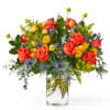 Bouquet of red and yellow roses in a clear glass vase