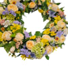 Circular floral wreath with cream roses, yellow daisies, and lavender blooms