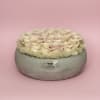 A timeless arrangement of premium ivory garden roses, artfully nestled in a