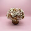 A timeless, luxurious arrangement featuring premium blush, ivory, champagne, and toffee roses
