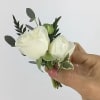 All of our boutonnieres include multiple blooms with touches of greenery. Each
