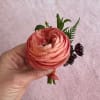 All of our boutonnieres include multiple blooms with touches of greenery. Each