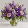 Lavender and purple bouquet in a clear glass vase