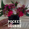 Small pocket square arrangement with pink and white flowers