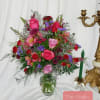Mixed bouquet of pink and red roses in a glass vase