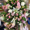 Large pink and white floral standing spray with ribbon