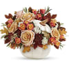 Autumn floral arrangement in a white pumpkin-shaped vase